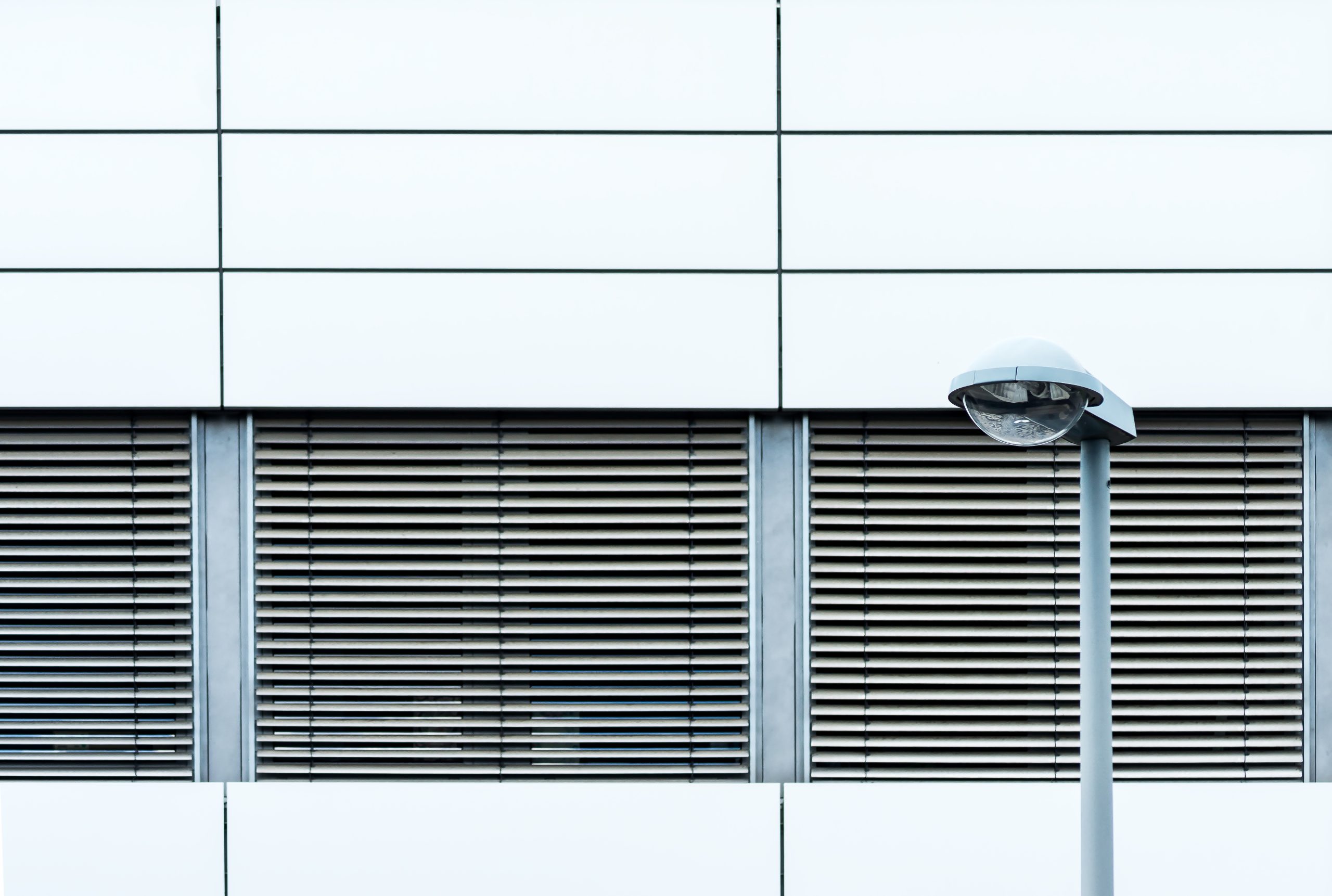 horizontal shot modern building s exterior with shutters from outdoors scaled